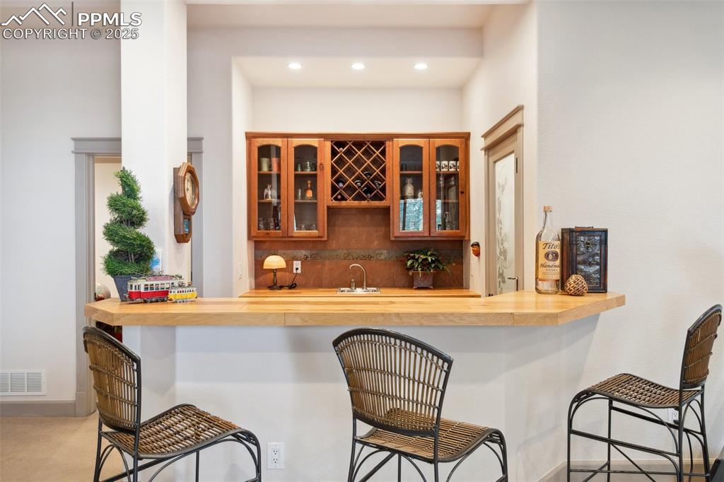 Image 43 of 49: Basement wet bar to enjoy your favorite beverage.