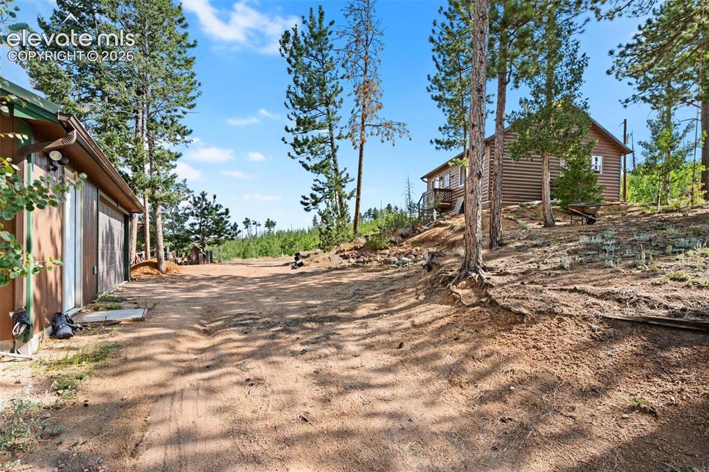 Image 21 of 31: Cabin and garage