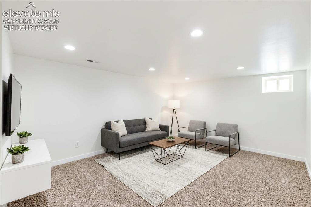Image 12 of 33: finished basement, virtually staged 