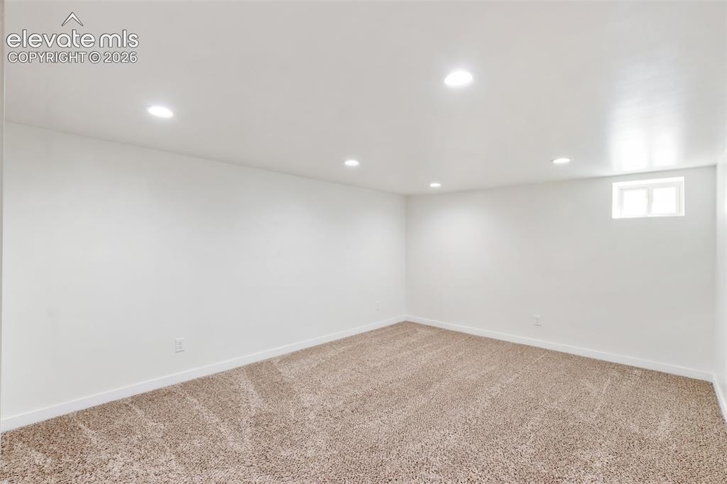 Image 28 of 33: finished basement, living room