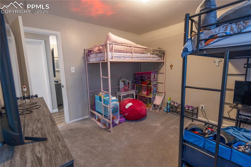 Image 9 of 11: Carpeted bedroom featuring baseboards