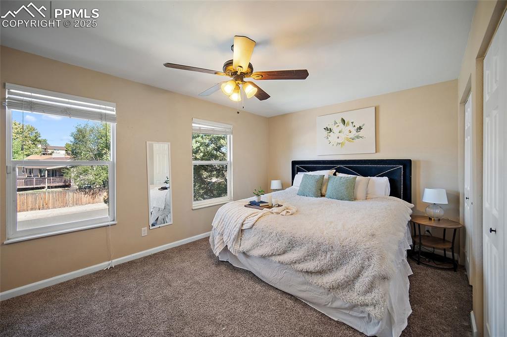 Image 23 of 45: Carpeted bedroom featuring a closet and a ceiling fan