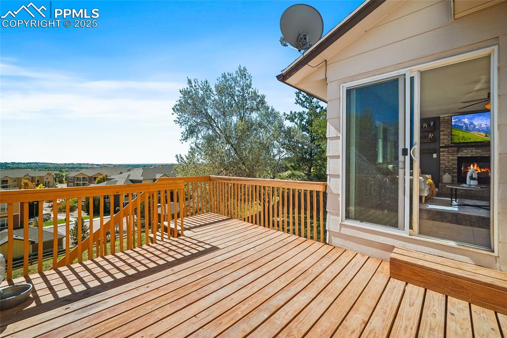 Image 31 of 45: Wooden terrace with a residential view