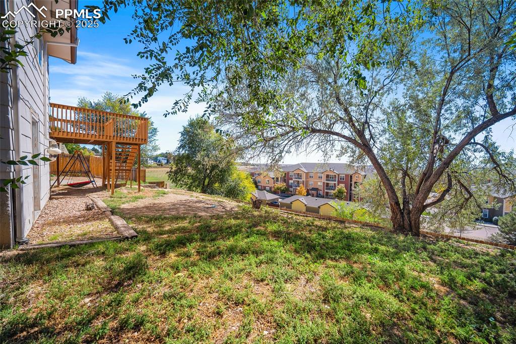 Image 40 of 45: View of yard featuring a patio area and stairway