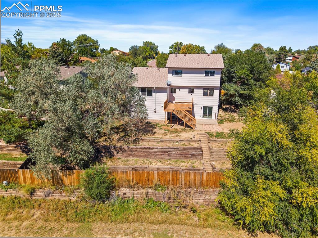 Image 45 of 45: Back of property featuring stairs