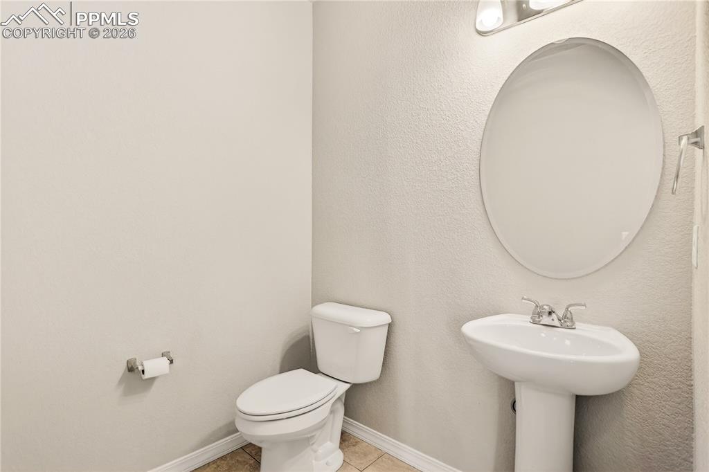 Image 17 of 38: Main level powder room off of the kitchen