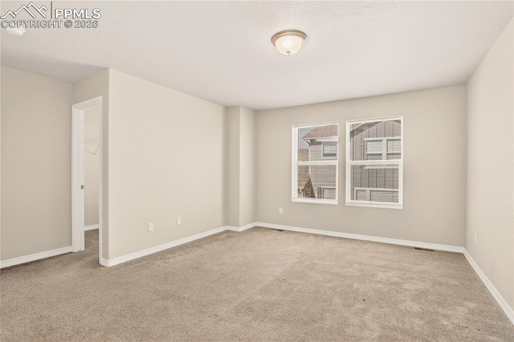 Image 21 of 38: Enter your Primary suite through the double doors