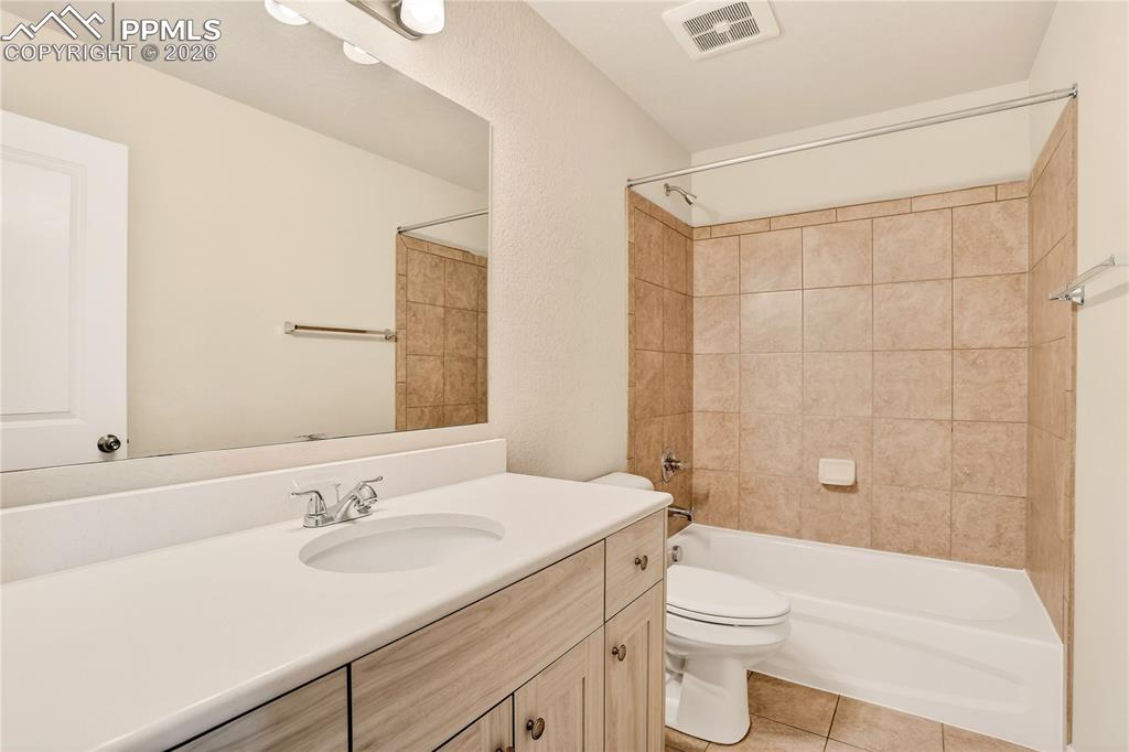 Image 28 of 38: Upper level second full bath. Linen closet outside of this bathroom is grea
