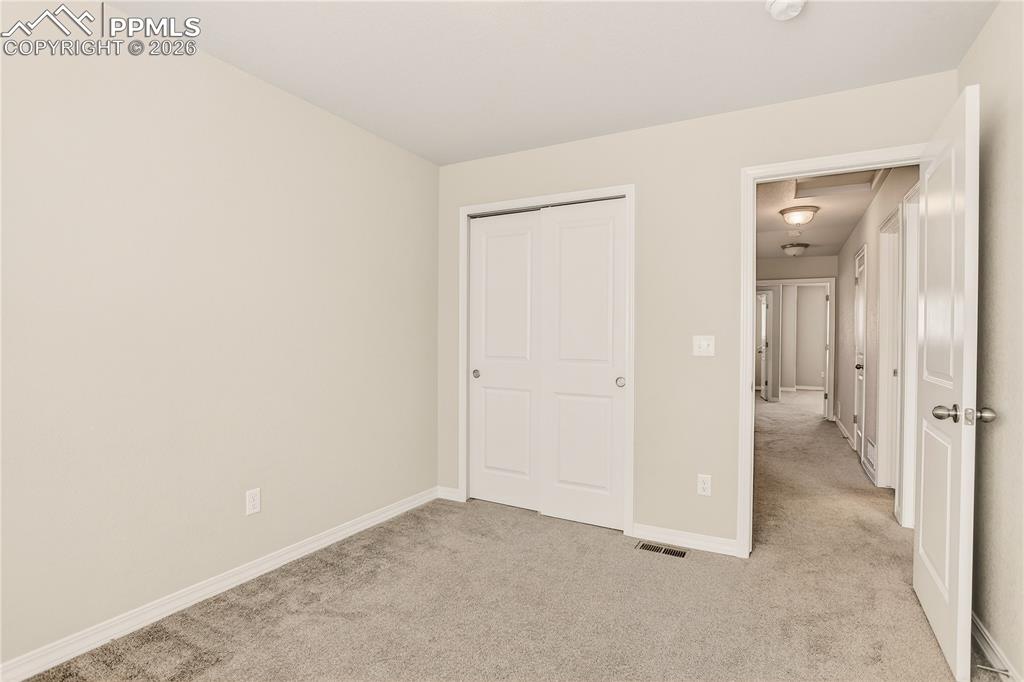 Image 30 of 38: Bedroom 3 is carpeted and has closet