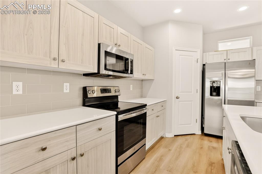 Image 9 of 38: Kitchen features walk-in pantry with plenty of cupboards for every chef!