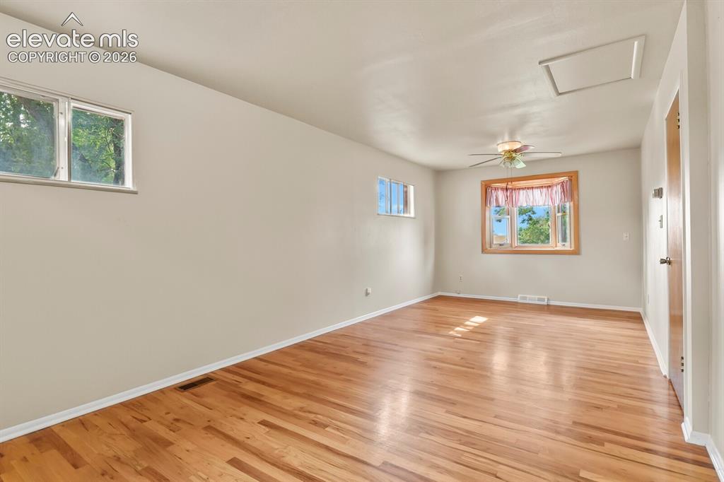 Image 18 of 45: Corner of Primary Bedroom looking towards the front bay window.