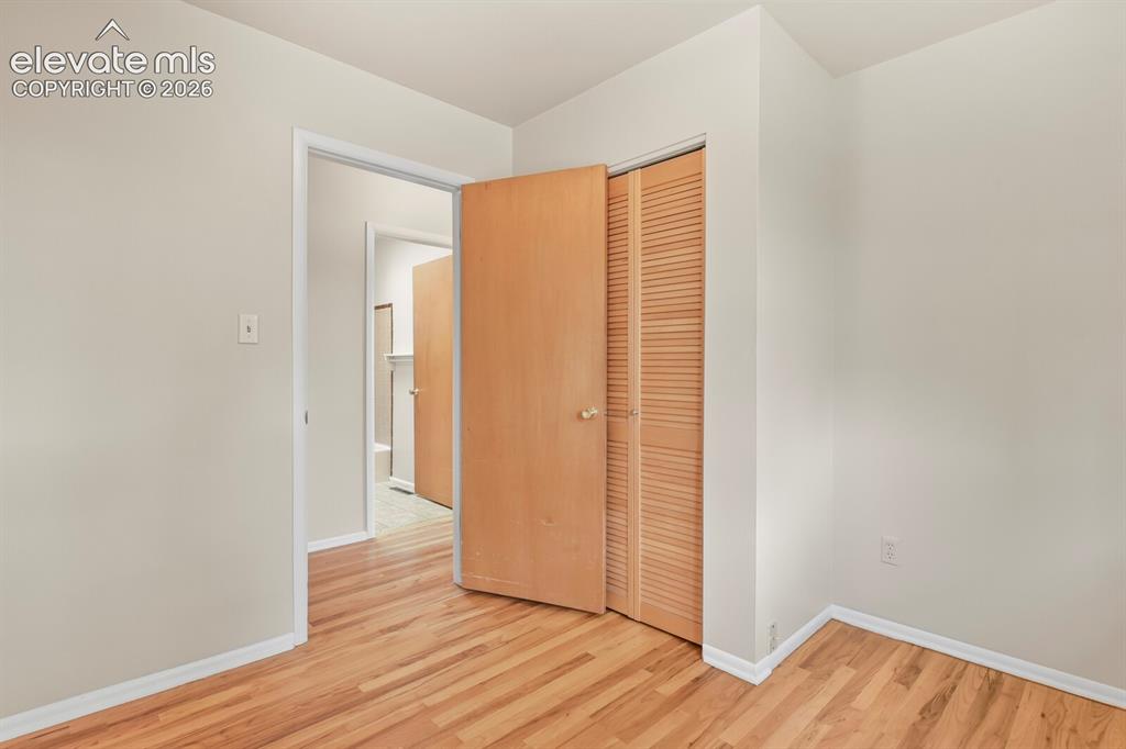 Image 21 of 45: Secondary bedroom, main floor.