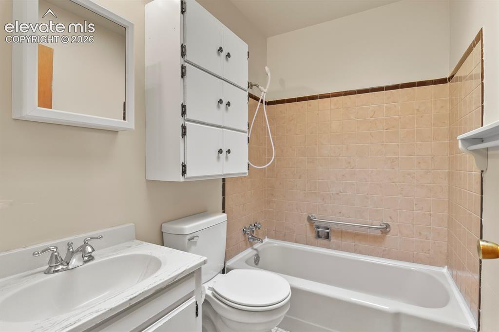 Image 22 of 45: Main level full bathroom.