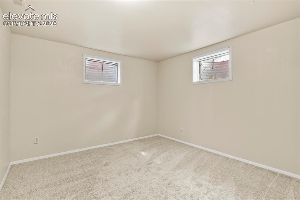 Image 31 of 45: Front-corner basement bedroom.