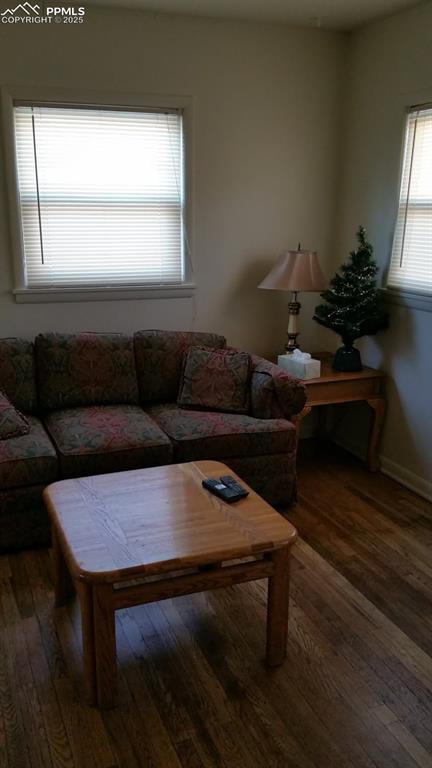Image 3 of 25: Living room featuring hardwood / wood-style flooring
