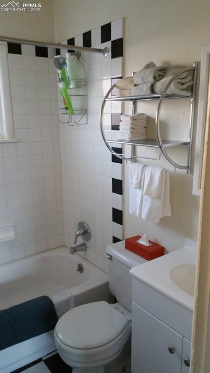 Image 5 of 25: Full bath with toilet, shower / bath combination, and vanity