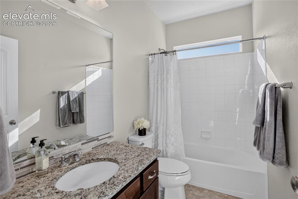 Image 15 of 29: Full guest bath - main level