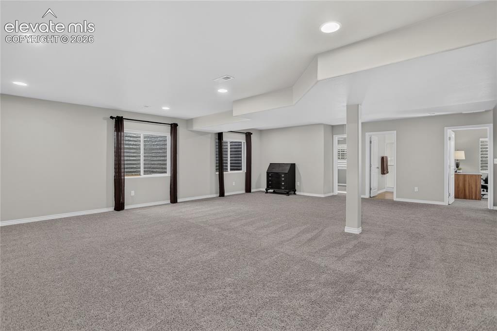 Image 17 of 29: Expansive lower level family room