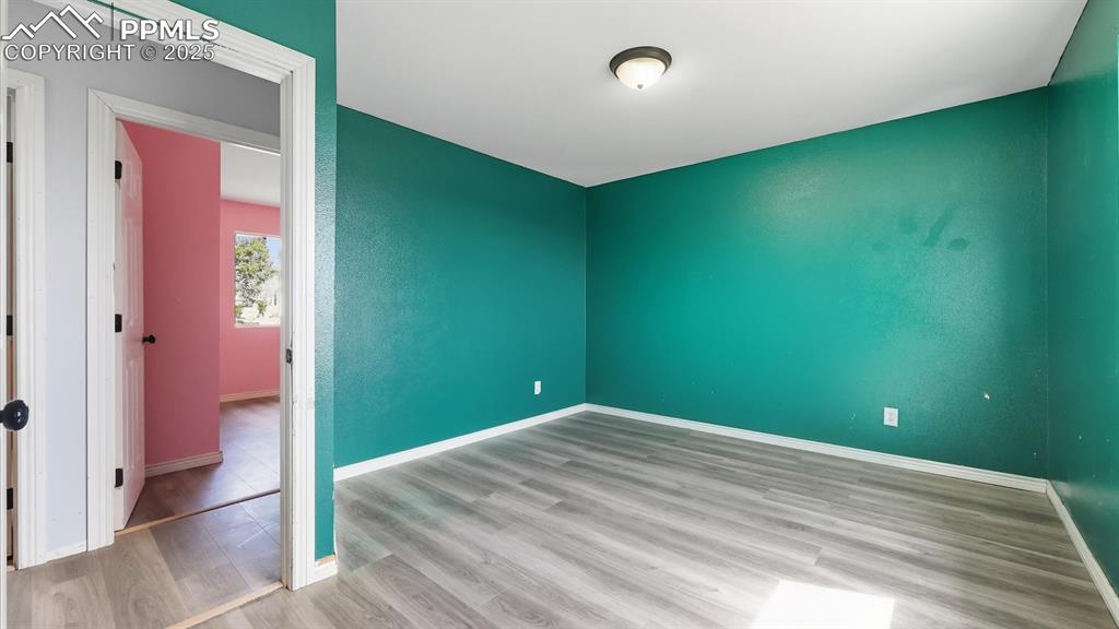 Image 17 of 34: Upper Level Bedroom #2 with LVP floors.