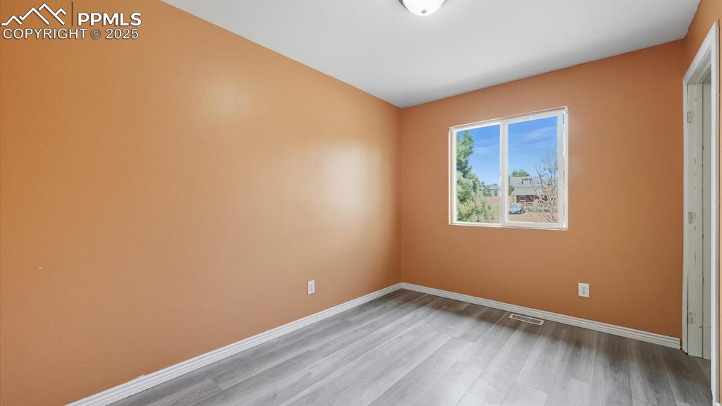 Image 19 of 34: Upper Level Bedroom #3 with LVP floors.