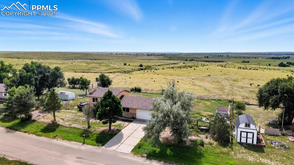 Image 2 of 34: Nestled on a tranquil half-acre, horse-zoned lot that backs to open space.