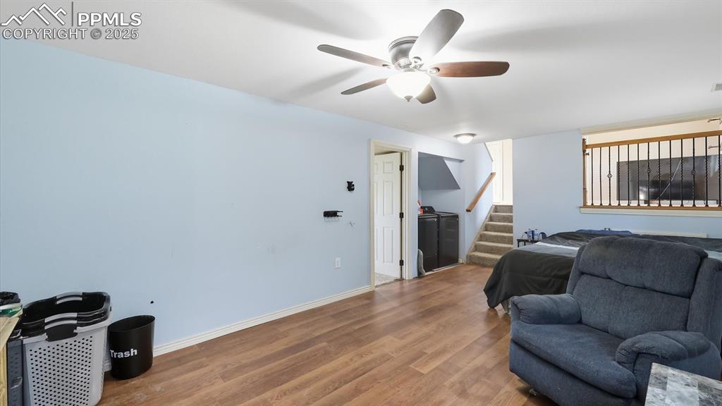 Image 22 of 34: Lower Level Family Room (currently used as a bedroom)