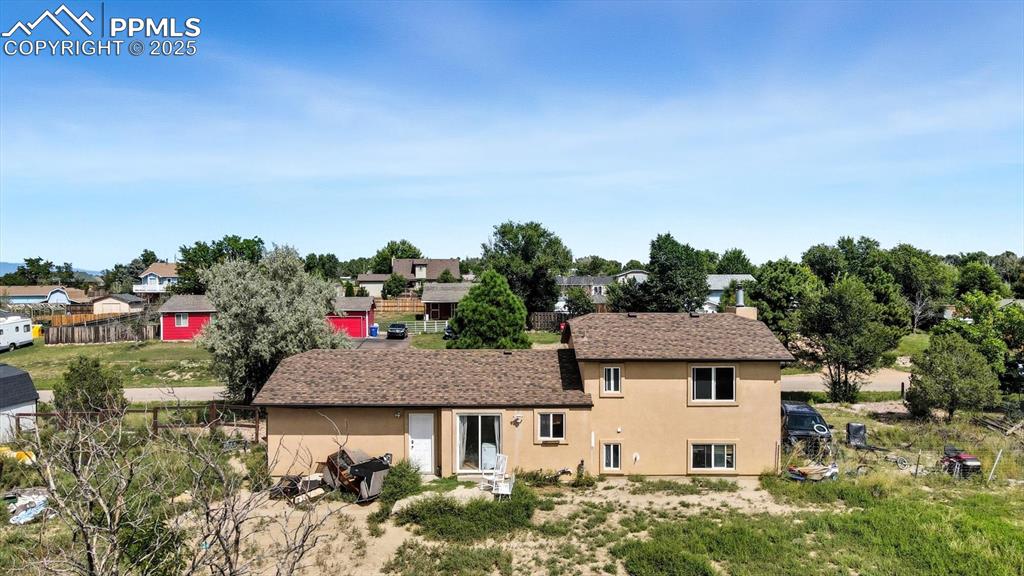 Image 30 of 34: Large half acre lot with room for RV or small boat or camper storage.