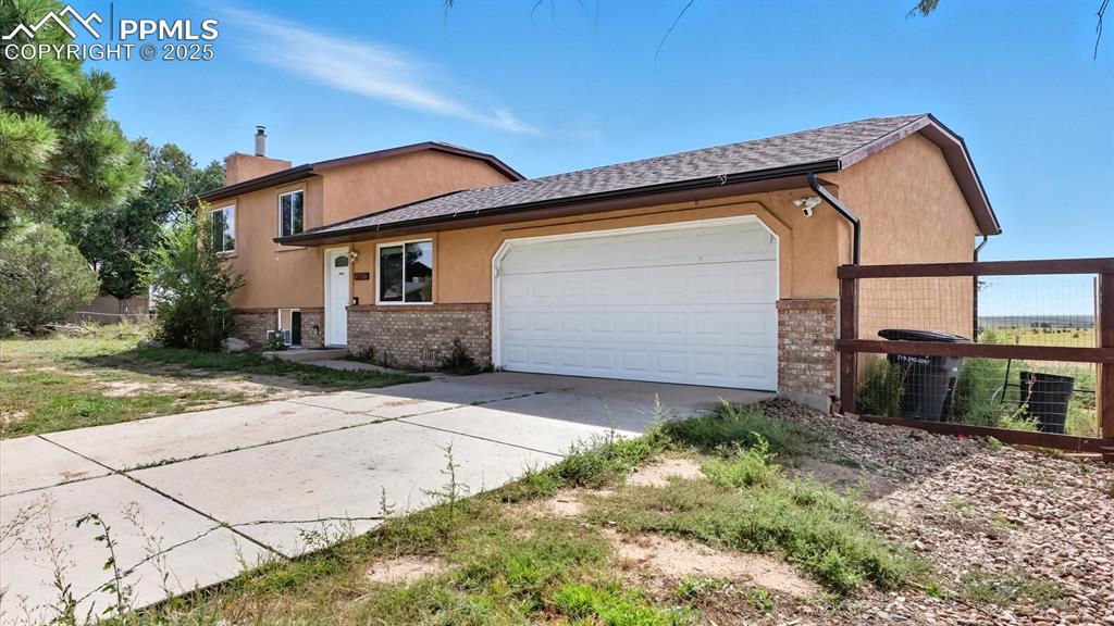 Image 5 of 34: 2-car attached garage with room in the side yard for RV or small boat stora