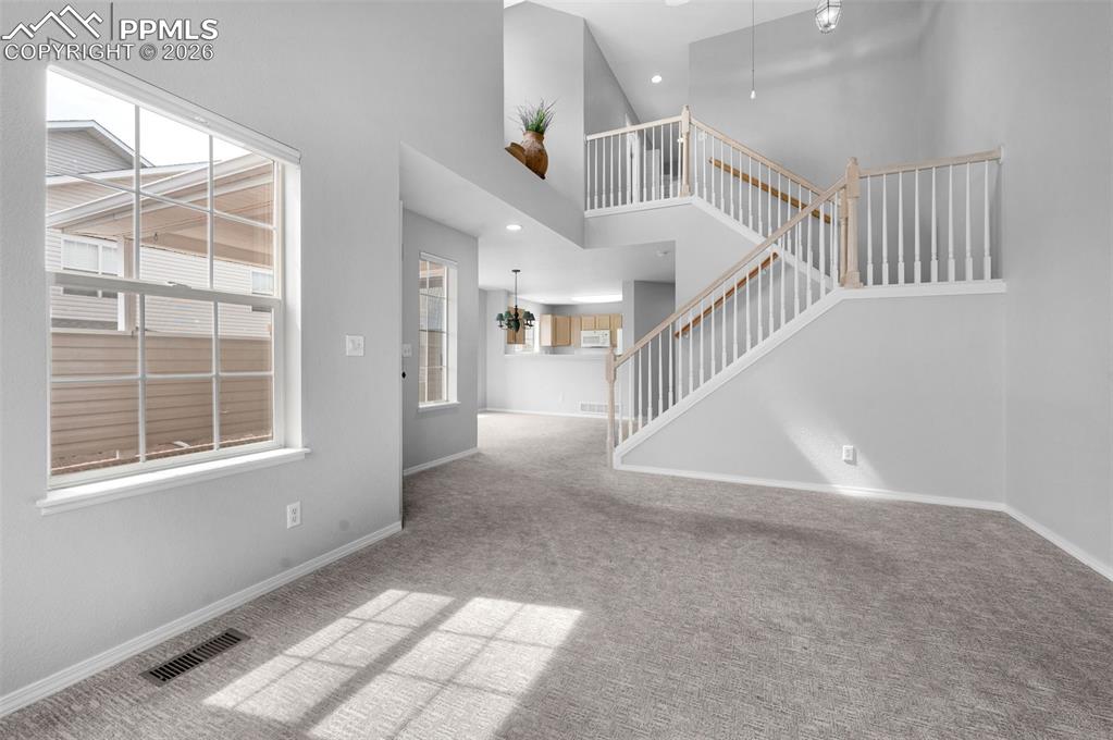 Image 7 of 27: Living room and stairway