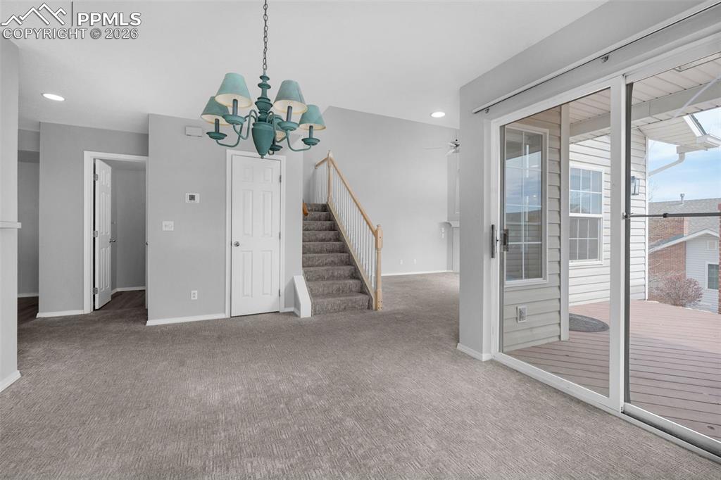 Image 8 of 27: Dining area with slider to outside patio