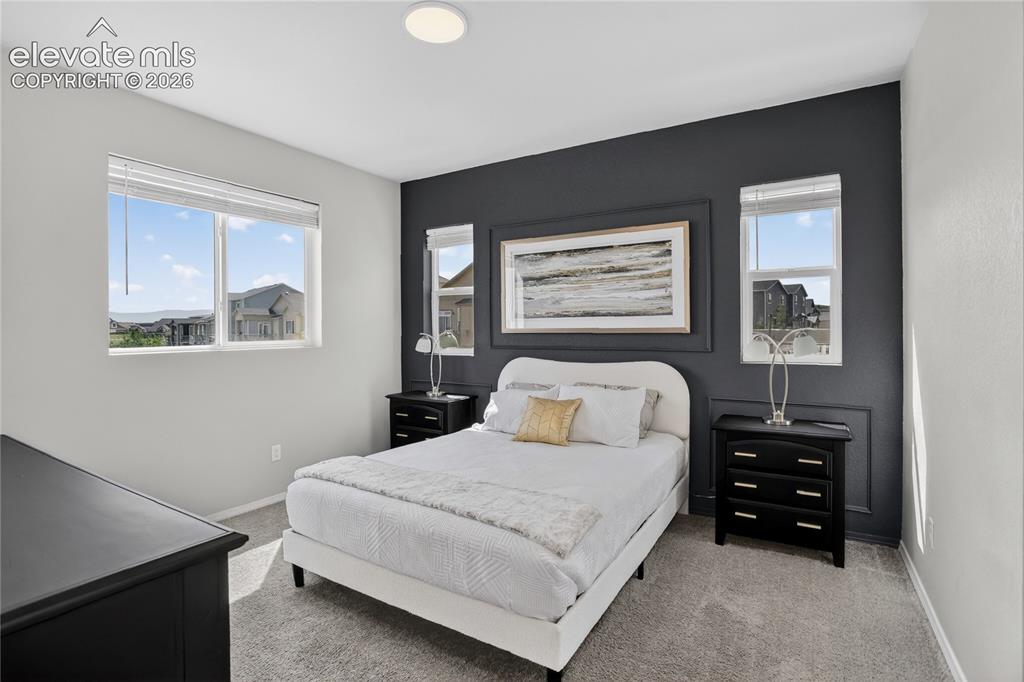 Image 10 of 30: Main-level primary suite