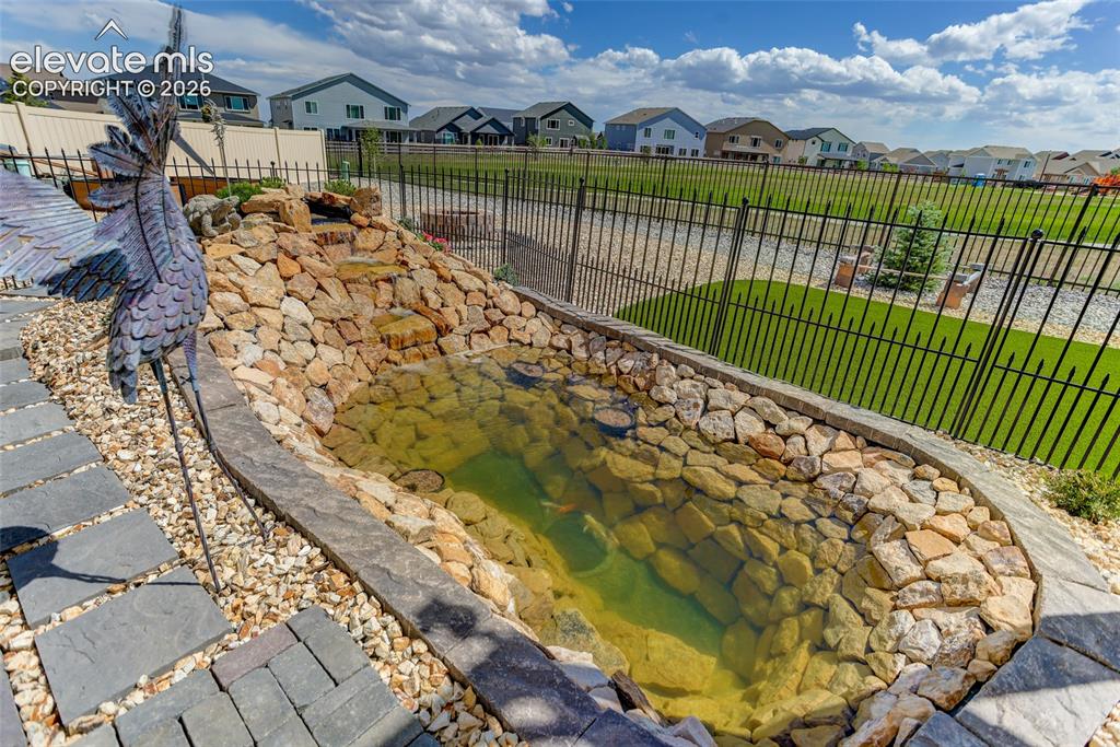 Image 25 of 29: Backyard water feature