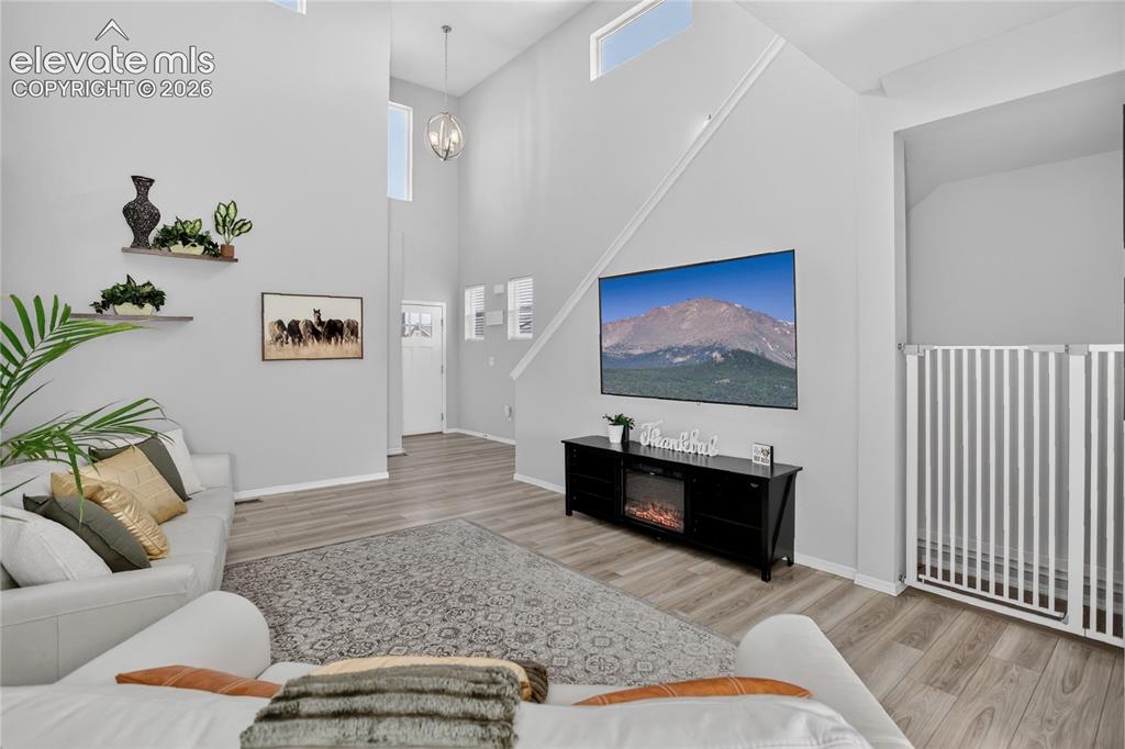 Image 3 of 30: Living room w/ LVP flooring