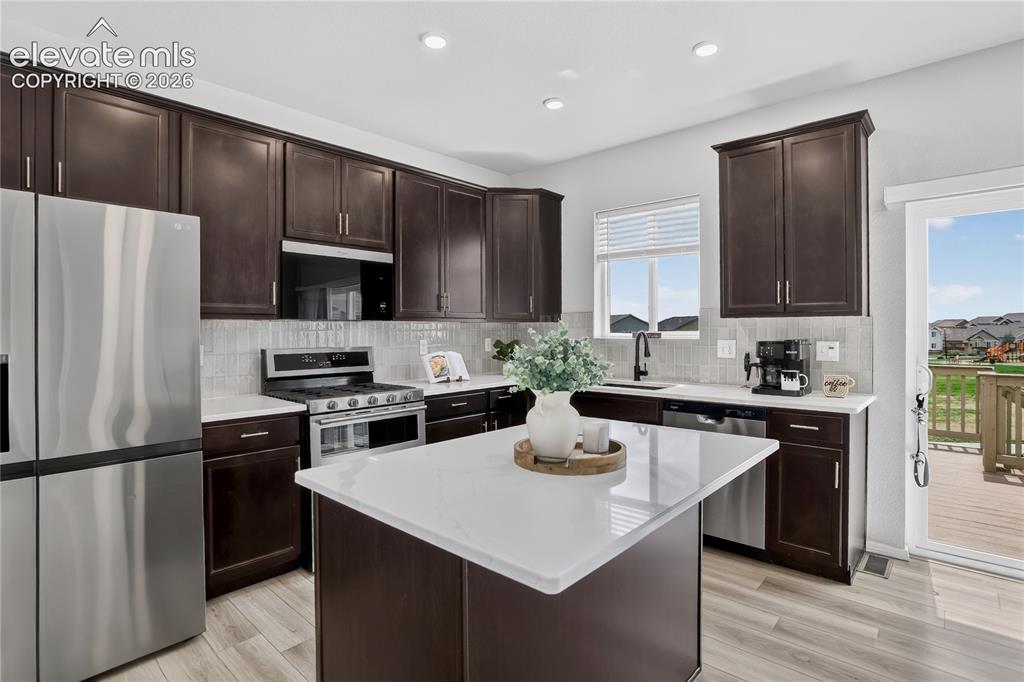 Image 8 of 30: Kitchen w/ SS appliances