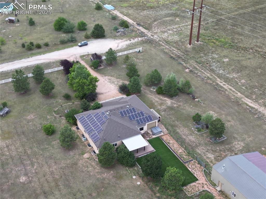 Image 14 of 48: Aerial view of property and surrounding area featuring rural landscape