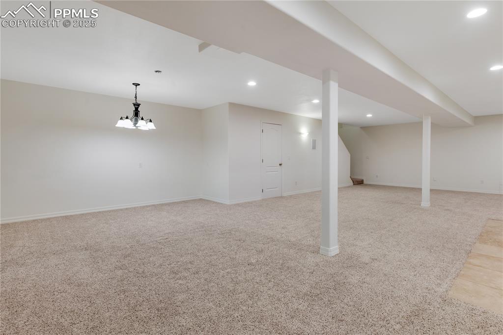 Image 32 of 48: Finished basement featuring light carpet and recessed lighting