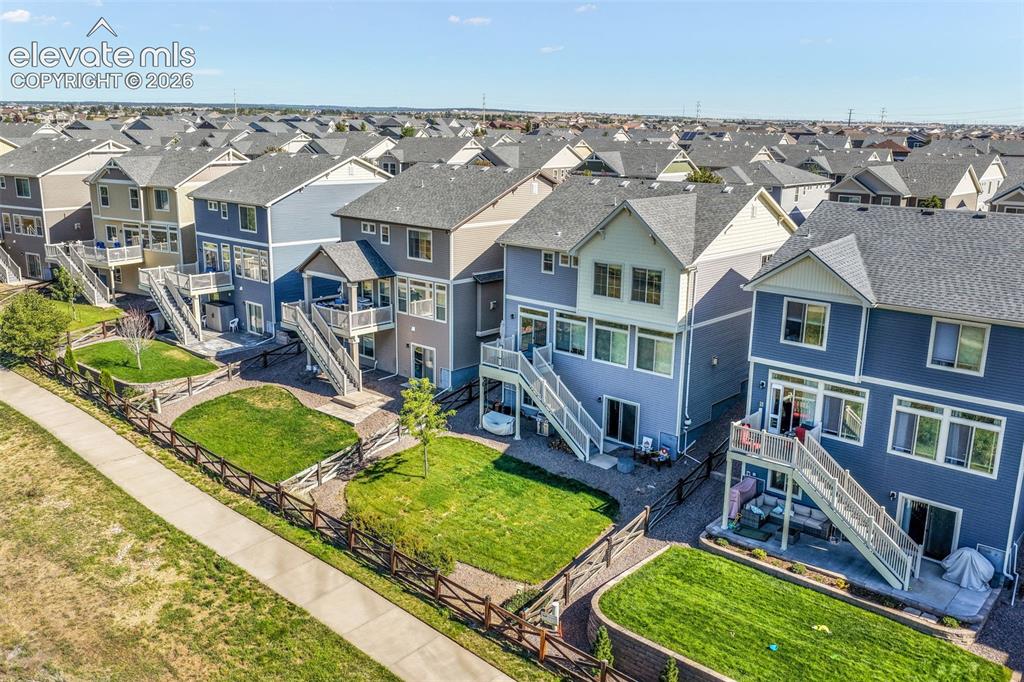 Image 46 of 48: Multi-story residences with varied exterior siding and multiple windows