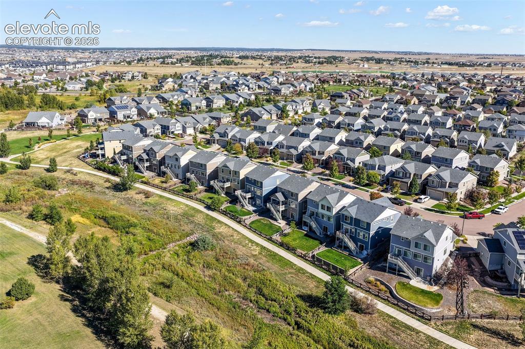 Image 47 of 48: Expansive neighborhood setting featuring a mix of detached and attached res