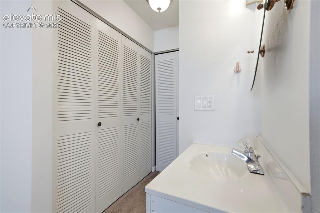 Image 17 of 19: Additional sink attached to primary bedroom
