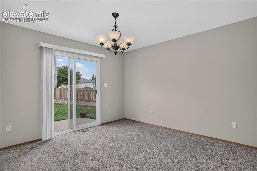 Image 12 of 36: Sliding glass door, light gray wall paint, dark wood-finish trim, ceiling-m