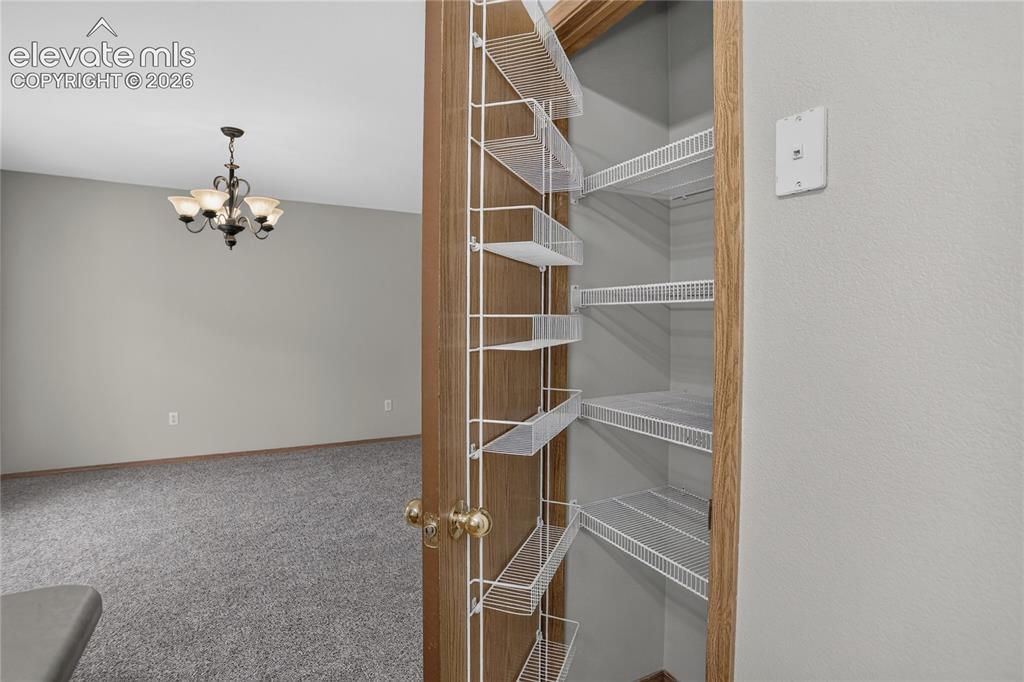 Image 17 of 36: Pantry with wire shelving