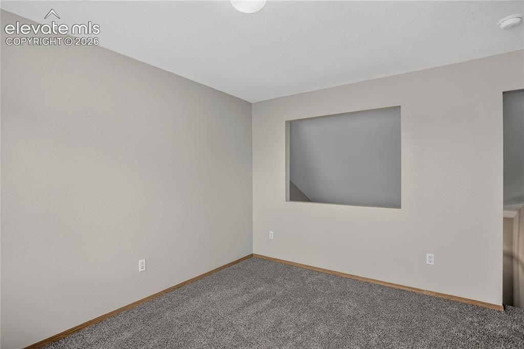 Image 21 of 36: Carpeted flooring, neutral wall color, built-in wall cutout, ceiling-mounte