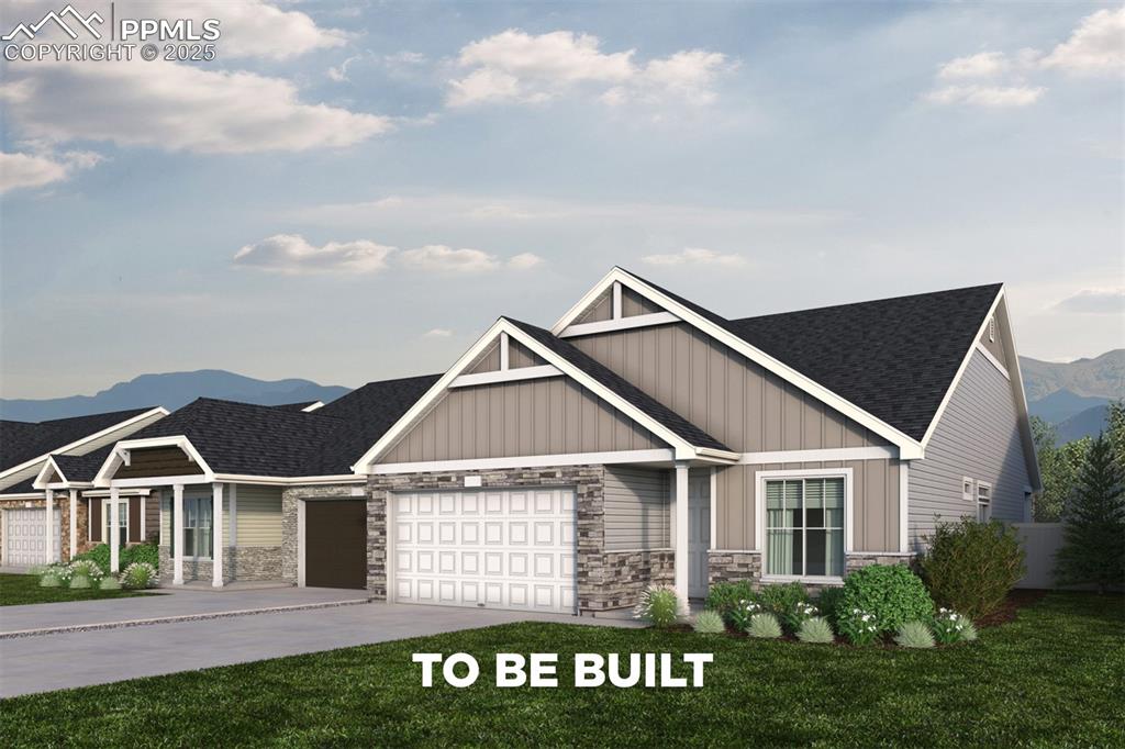 Caption: Craftsman inspired home featuring stone siding, a mountain view, an attached garage, concrete drivew
