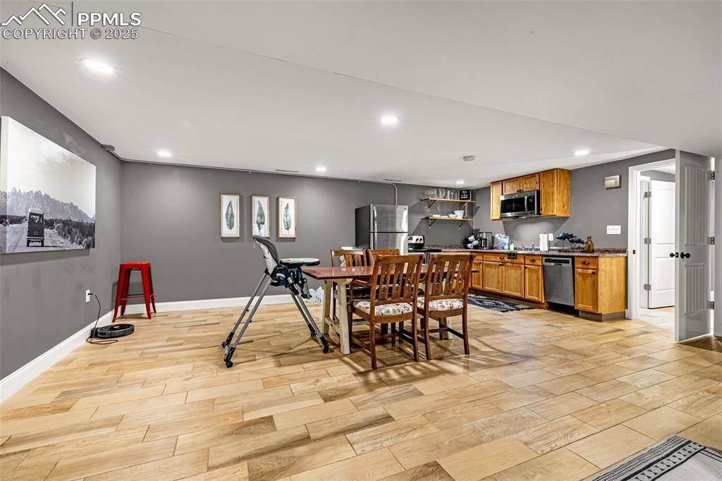 Image 20 of 43: Dining room with recessed lighting and light wood-type flooring