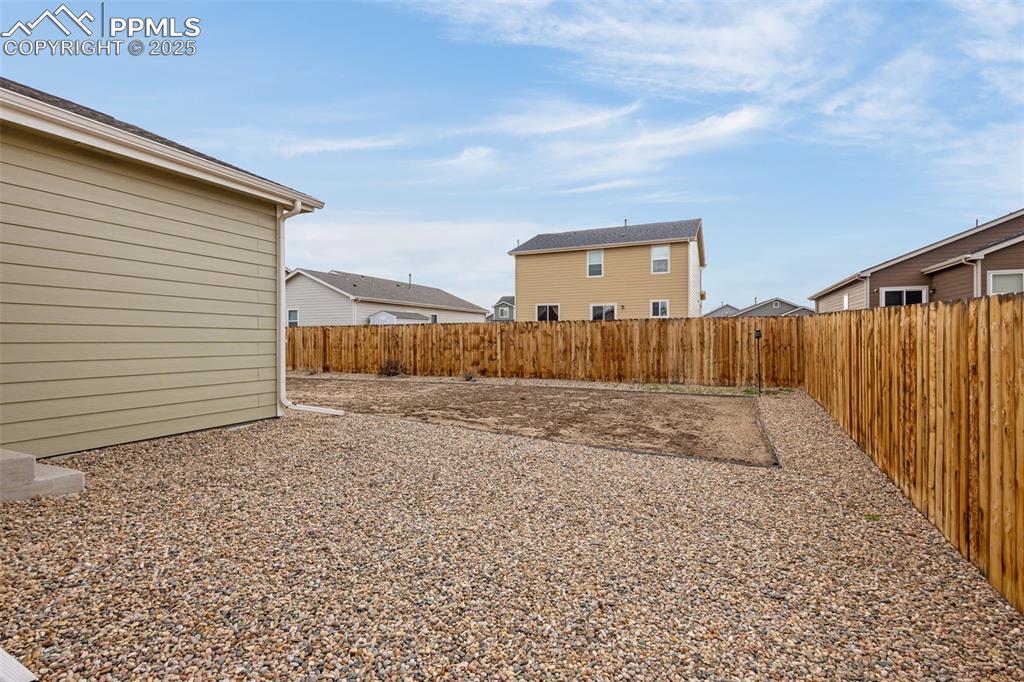 Image 21 of 28: View of yard featuring a fenced backyard