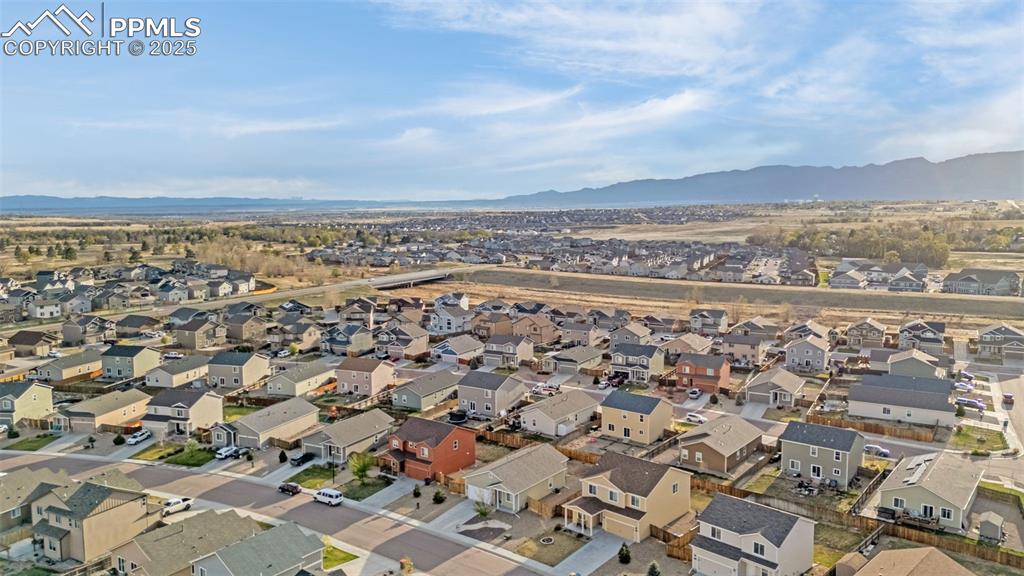 Image 26 of 28: Drone / aerial view featuring a residential view and a mountain view