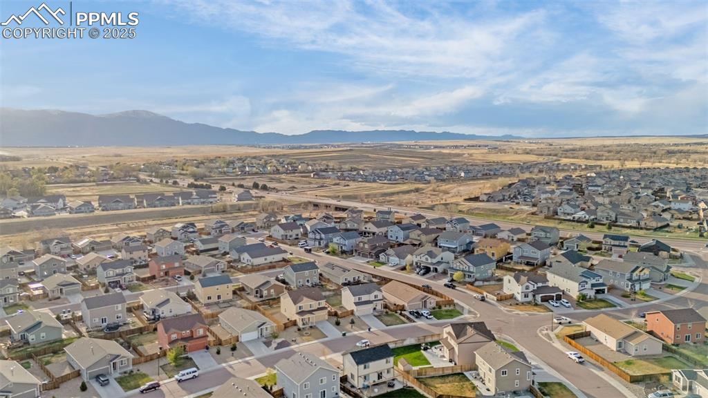 Image 28 of 28: Aerial view with a mountain view and a residential view