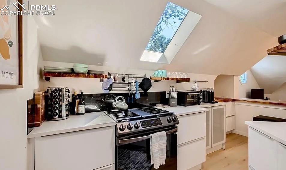 Image 11 of 18: Upper level kitchen