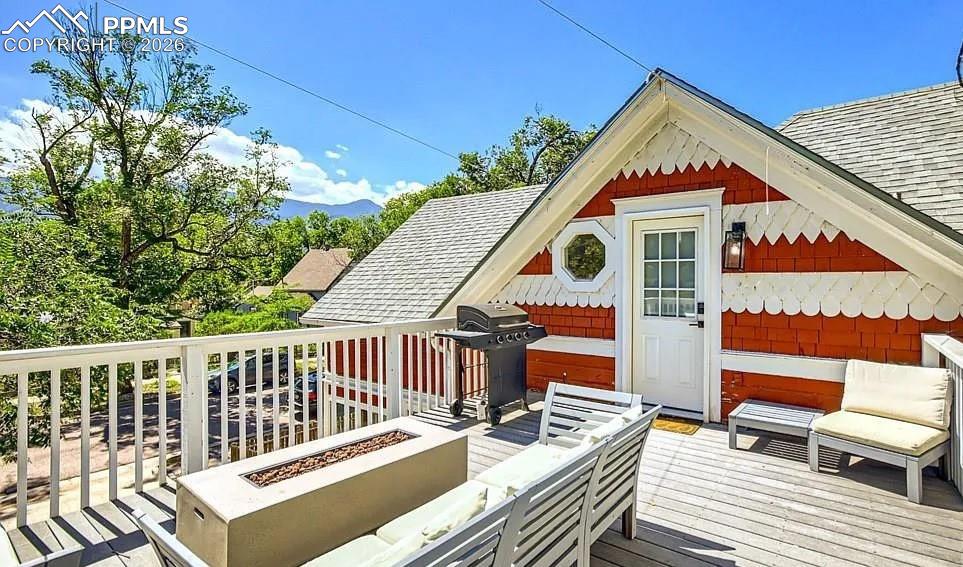 Image 9 of 18: Upper level entry and deck