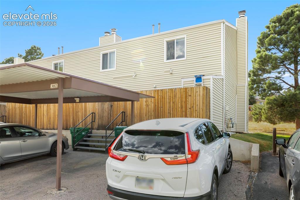 Image 26 of 26: Covered Carport and additional parking